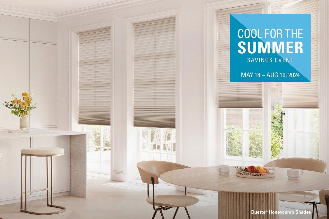 Living room featuring large windows with Hunter Douglas Duette® Honeycomb shades.